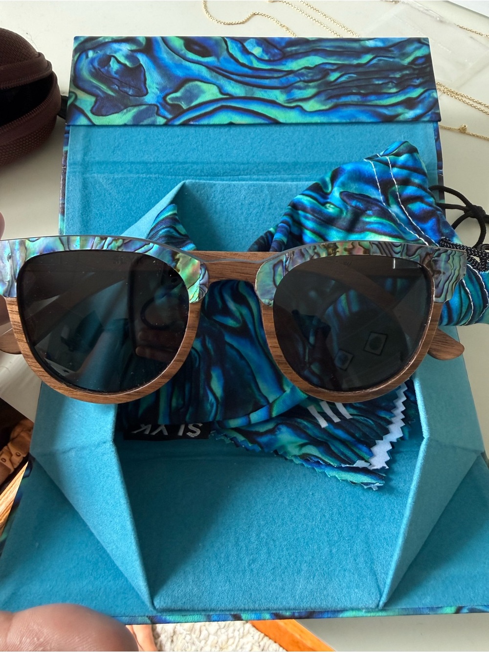Slyk Shades Sunglasses with Blue-Green Abalone Accent. New, in box without tags
